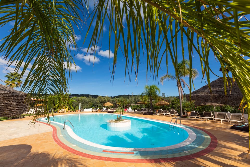 Seasonal outdoor pool, open 8:30 AM to 8:00 PM, pool umbrellas