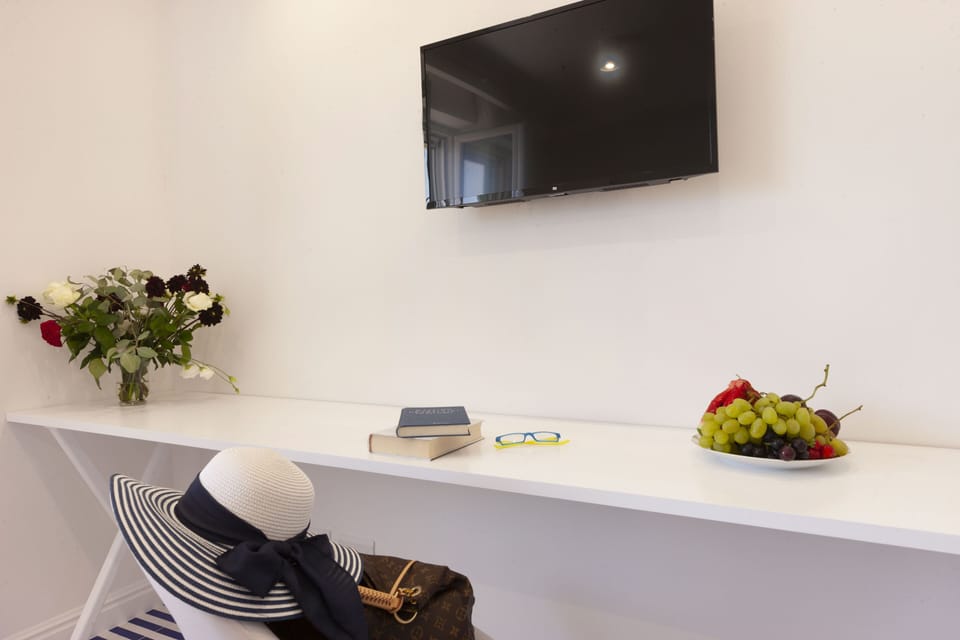 Exclusive Room, Sea View | Minibar, in-room safe, desk, laptop workspace