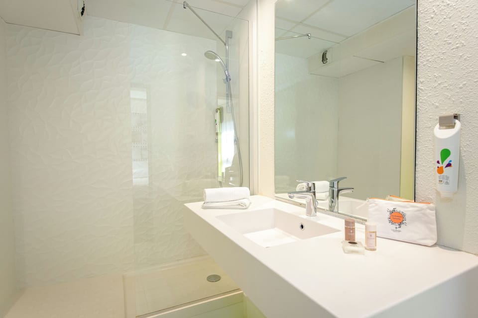 Shower, eco-friendly toiletries, hair dryer, towels