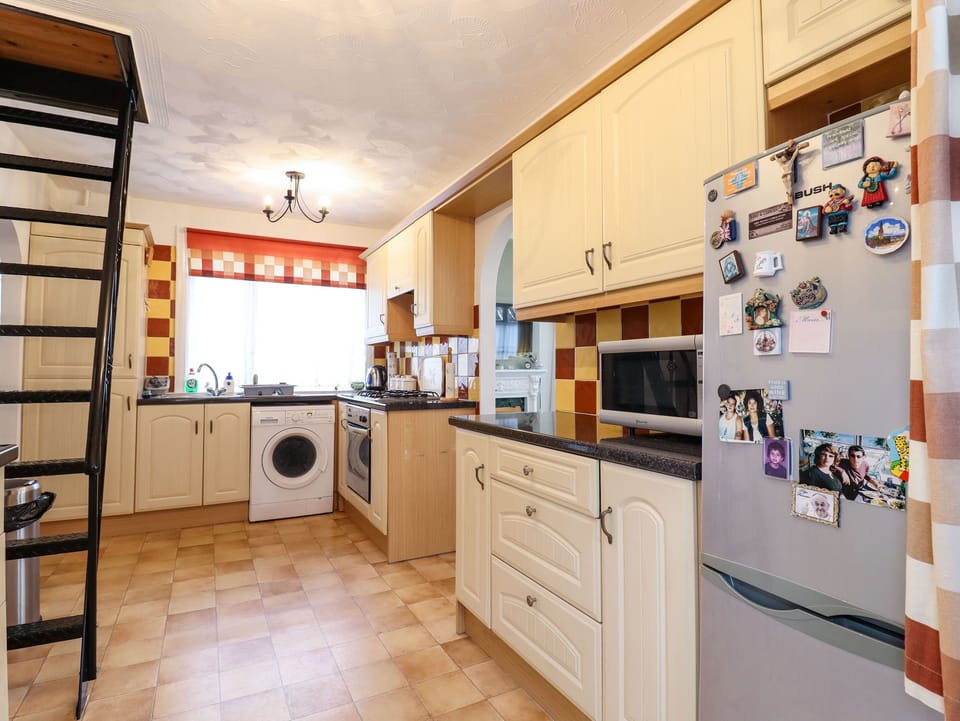 Fridge, electric kettle, toaster, cookware/dishes/utensils