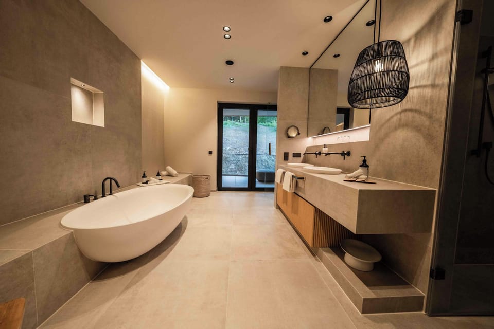 Suite | Bathroom | Hair dryer, bathrobes, slippers, towels