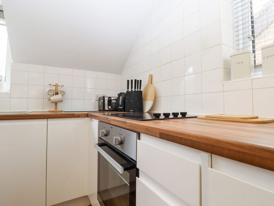 Fridge, electric kettle, toaster, cookware/dishes/utensils