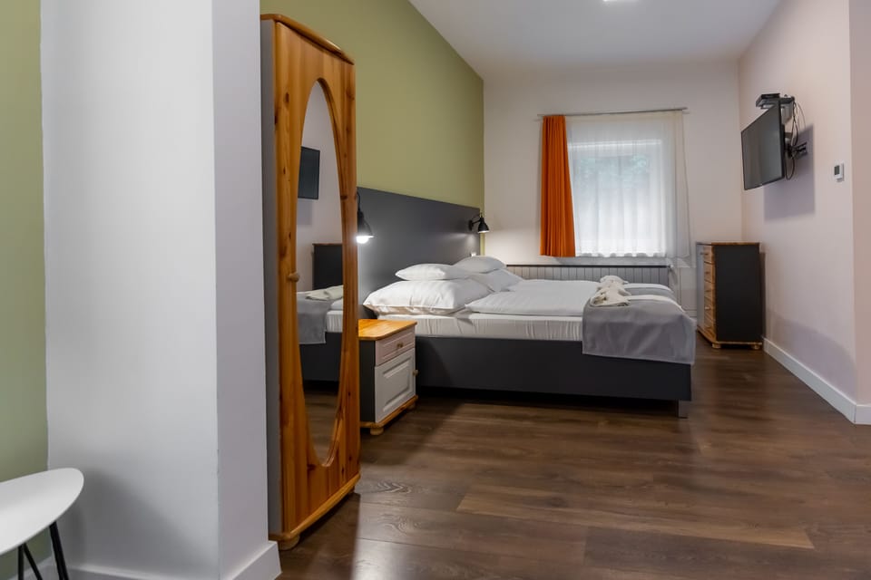 Quadruple Room | In-room safe, desk, blackout drapes, iron/ironing board