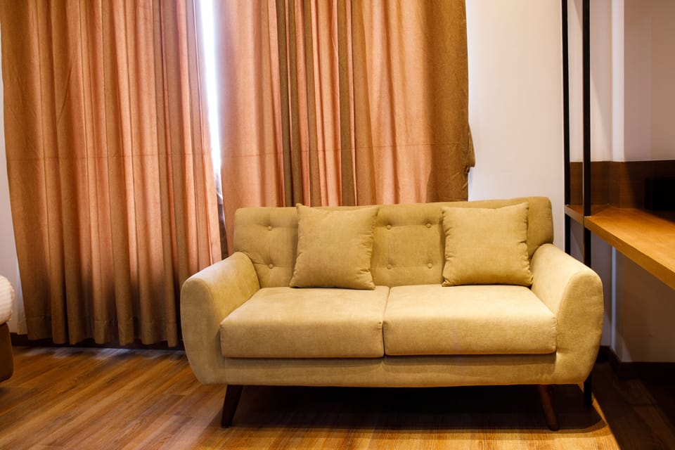 Premium bedding, desk, laptop workspace, soundproofing