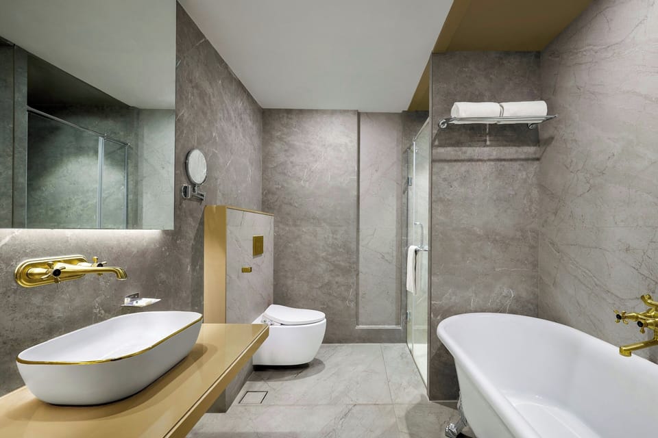 Classic Suite, 1 King Bed (View) | Bathroom | Rainfall showerhead, hair dryer, bathrobes, slippers