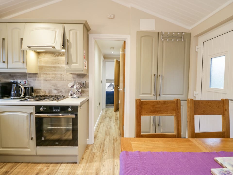 Fridge, electric kettle, toaster, cookware/dishes/utensils