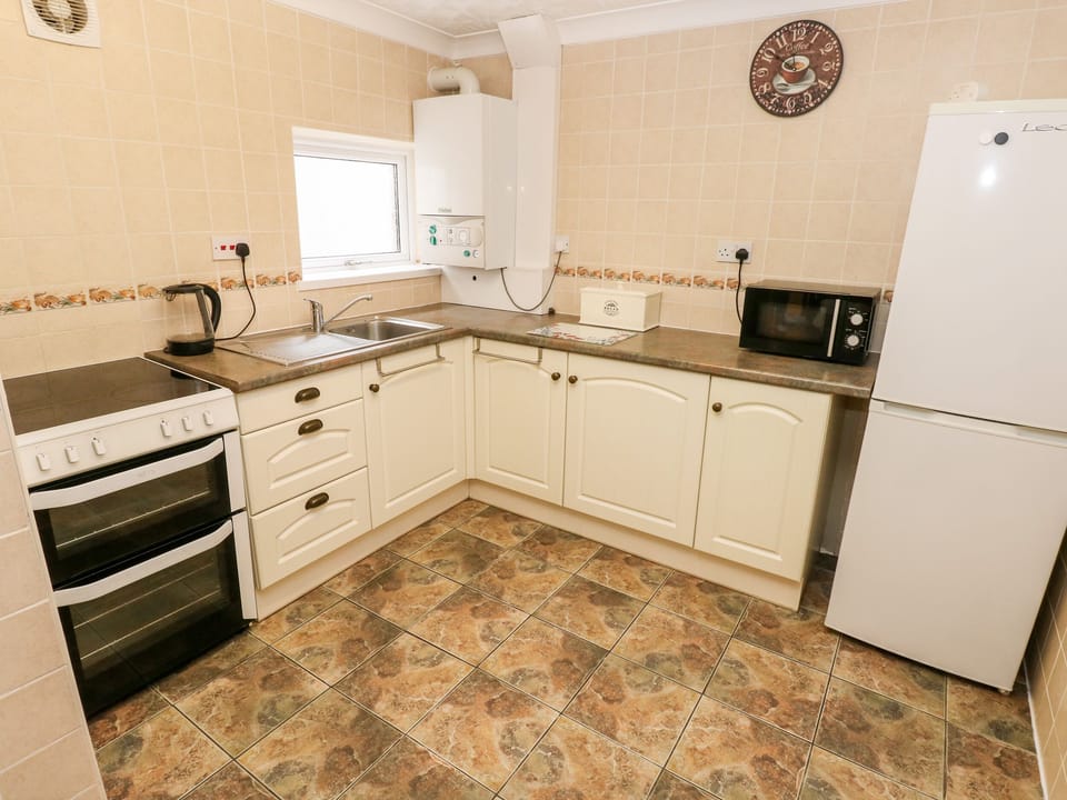 Fridge, electric kettle, toaster, cookware/dishes/utensils