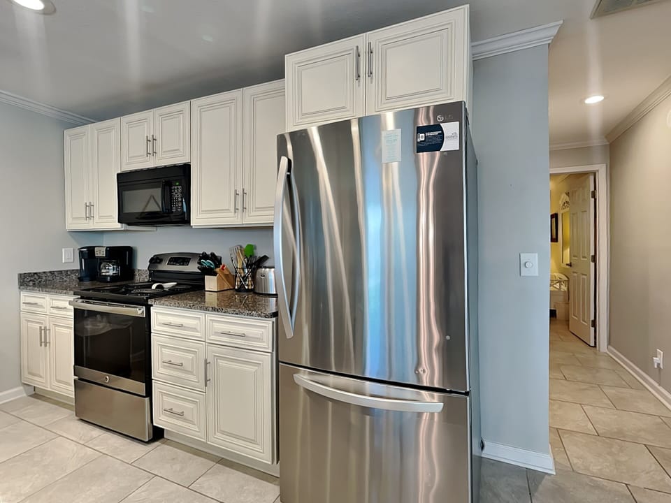 Condo, Multiple Beds, Balcony (A - No Pets Allowed) | Private kitchen | Coffee/tea maker, dining tables