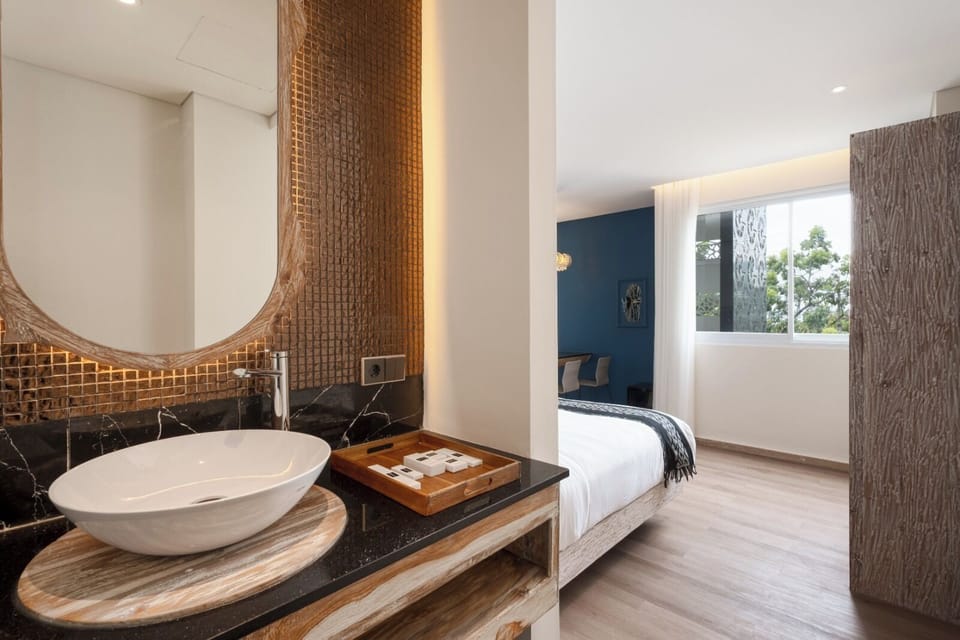 Family Suite (102) | Bathroom | Shower, hair dryer, slippers, bidet