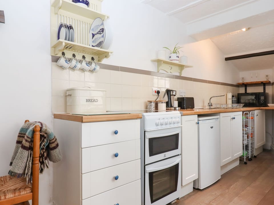 Fridge, toaster, cookware/dishes/utensils