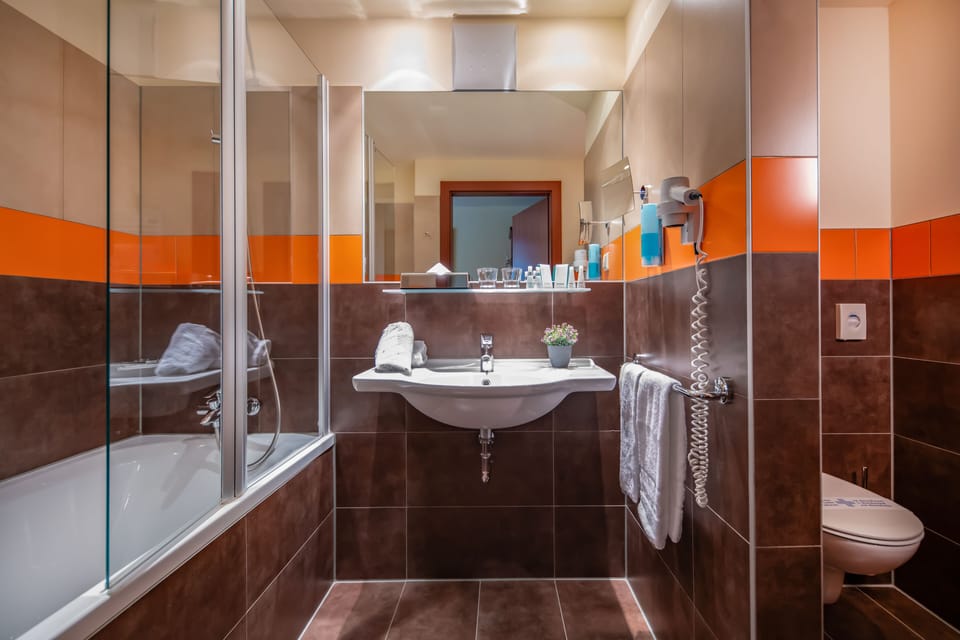 Combined shower/tub, free toiletries, bathrobes, slippers