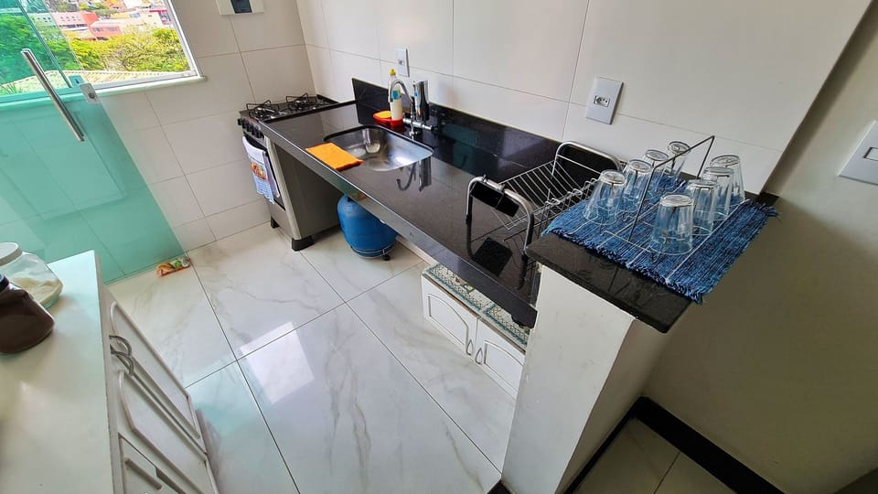 Villa | Private kitchen | Fridge, microwave, oven, blender