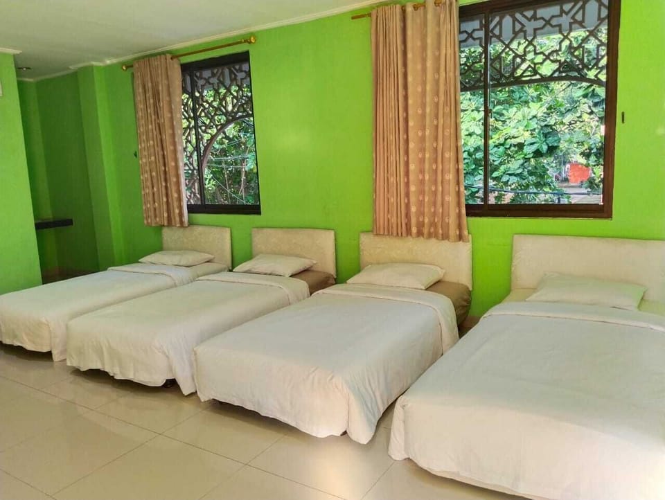 Standard Quadruple Room | Down comforters, desk, bed sheets