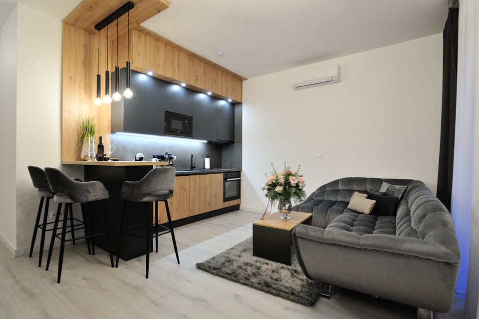 Exclusive Apartment, 2 Bedrooms, Kitchen | Living area | 56-inch Smart TV with cable channels, TV