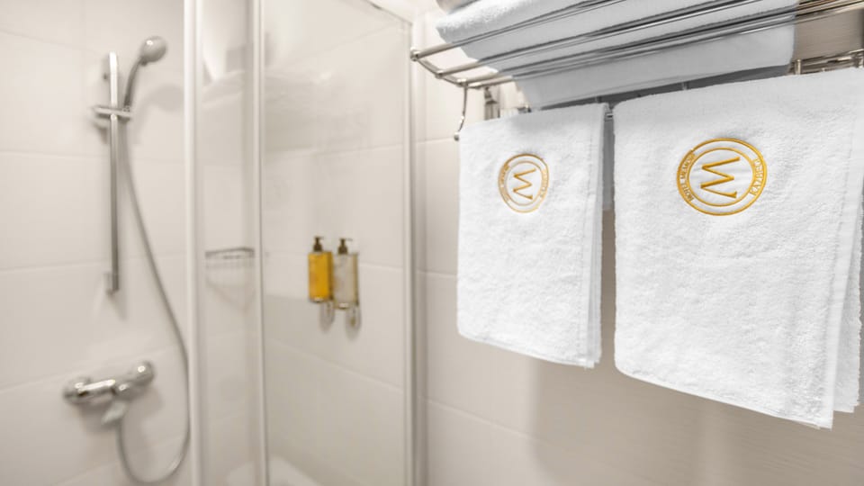Shower, hydromassage showerhead, slippers, towels
