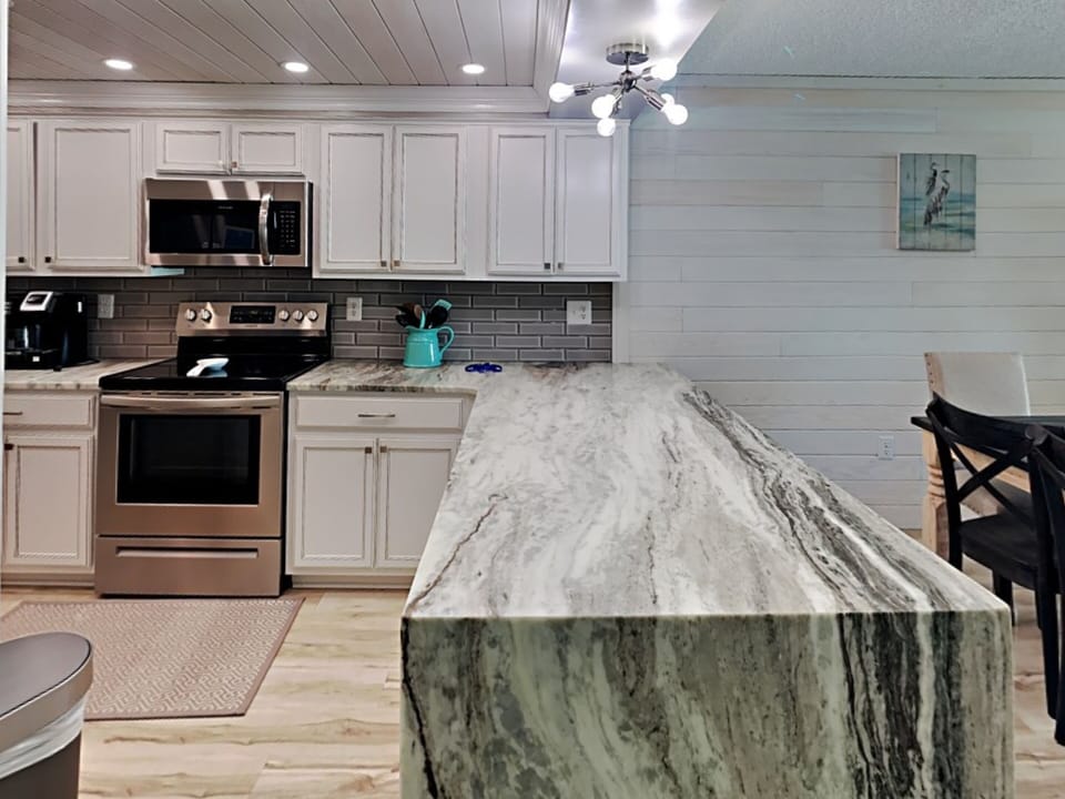 Condo, Multiple Beds, Balcony, Ocean View | Private kitchen | Fridge, microwave, oven, stovetop