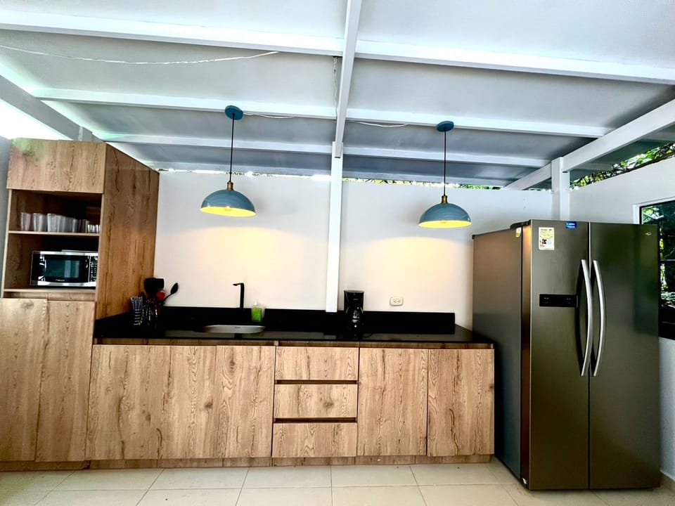 Villa | Private kitchen | Full-size fridge, microwave, coffee/tea maker, blender