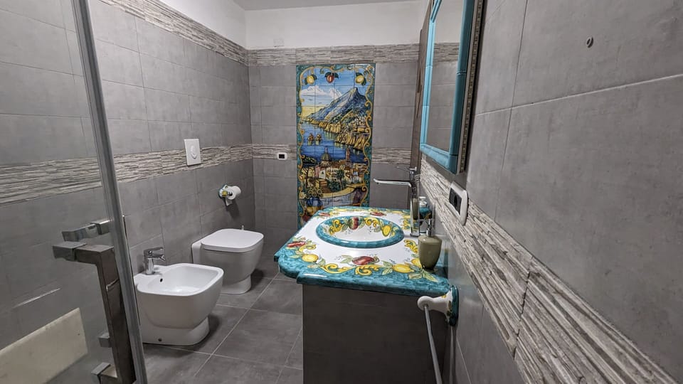 Signature Room, 1 Bedroom, City View | Bathroom | Shower, hair dryer, bathrobes, slippers