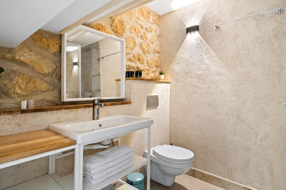Shower, rainfall showerhead, hair dryer, towels