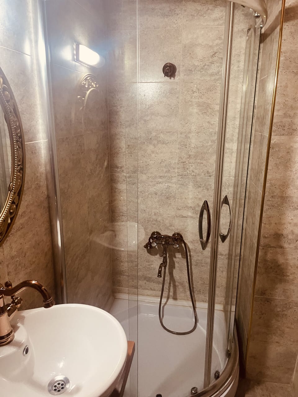 Shower, rainfall showerhead, hair dryer, towels