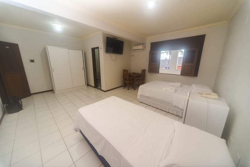 Comfort Triple Room | Minibar, in-room safe, desk, laptop workspace