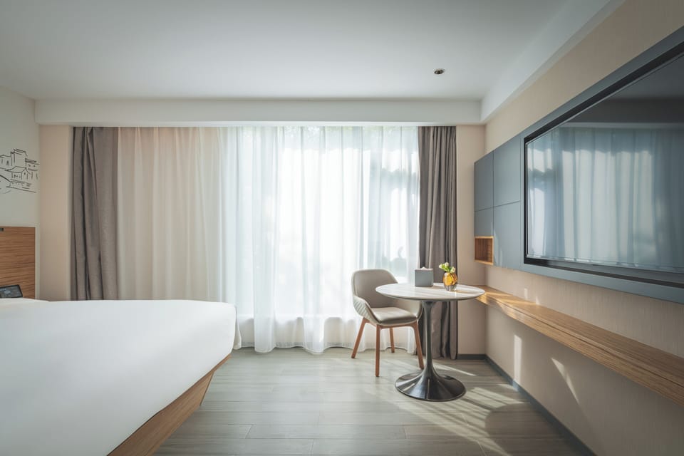 Down comforters, memory foam beds, minibar (free items), in-room safe