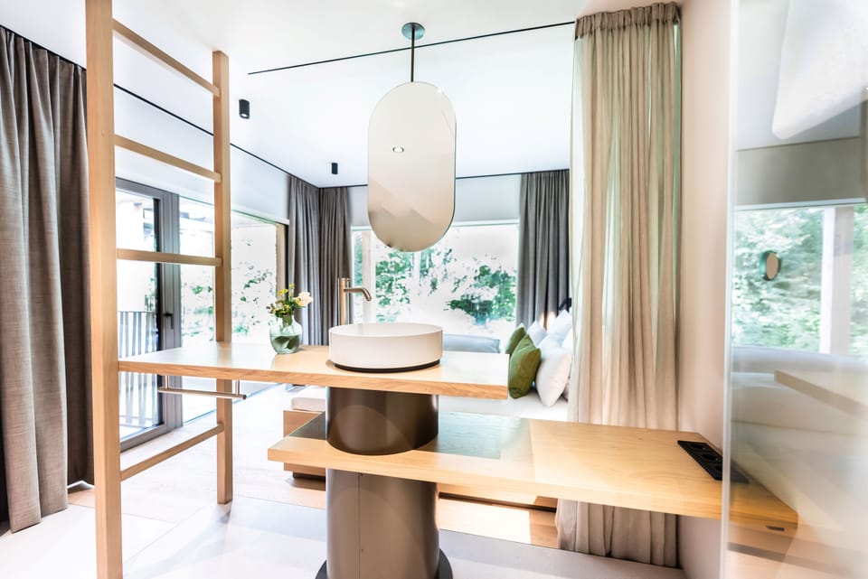 Suite, 1 King Bed with Sofa bed, Balcony | Bathroom | Free toiletries, hair dryer, bathrobes, heated floors
