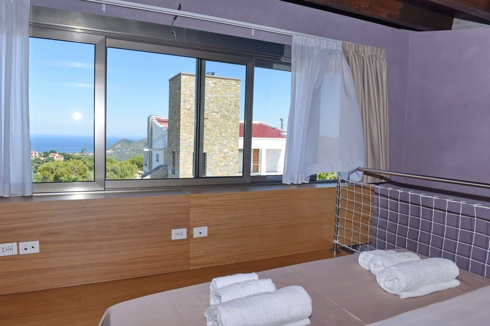 Deluxe Duplex, Pool Access, Sea View | Minibar, in-room safe, soundproofing, free WiFi