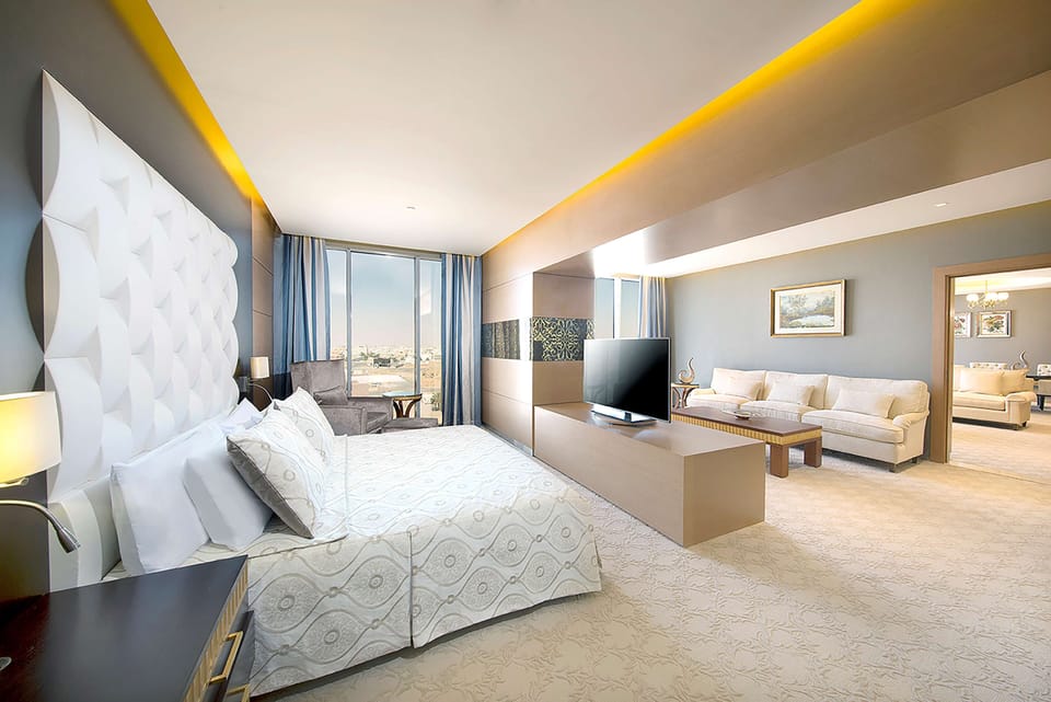 Deluxe Suite, 1 Bedroom | Living area | 42-inch LED TV with cable channels, TV