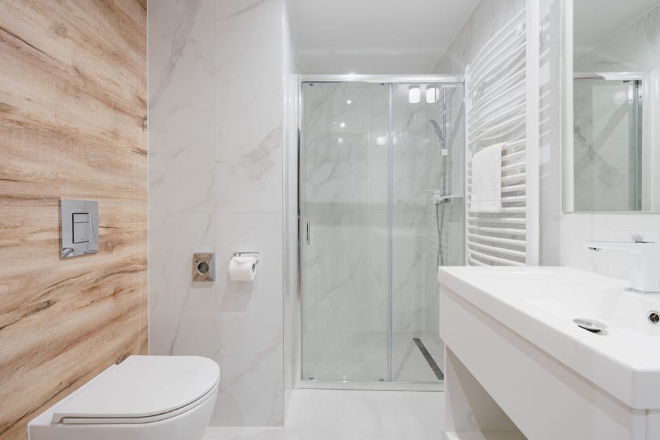 Shower, rainfall showerhead, designer toiletries, hair dryer