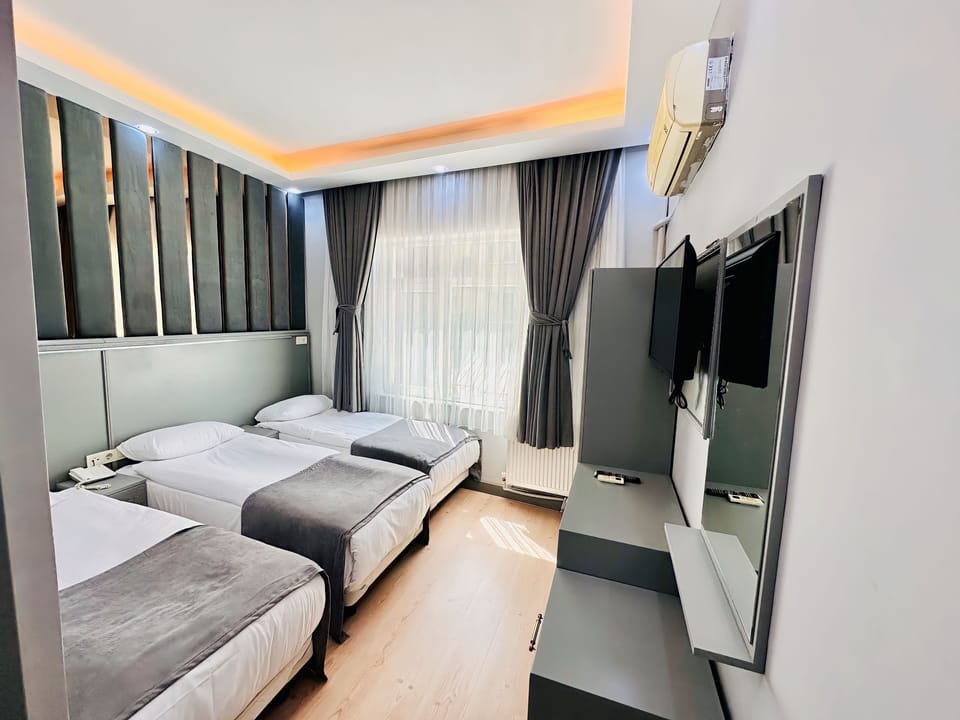 Standard Triple Room | In-room safe, blackout drapes, iron/ironing board, free WiFi