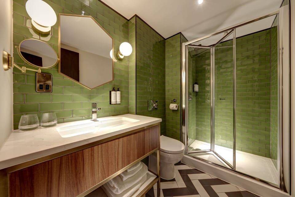Designer toiletries, hair dryer, bathrobes, slippers