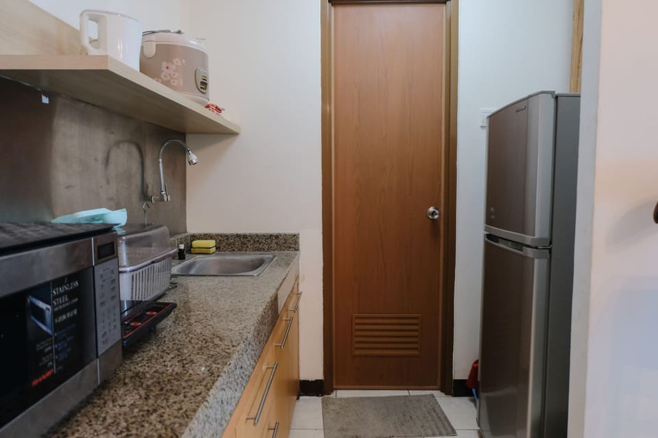 Apartment, 2 Bedrooms | Private kitchen | Full-size fridge, stovetop