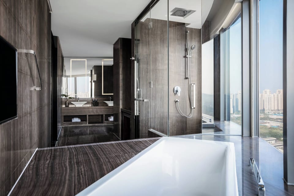 Separate tub and shower, jetted tub, rainfall showerhead