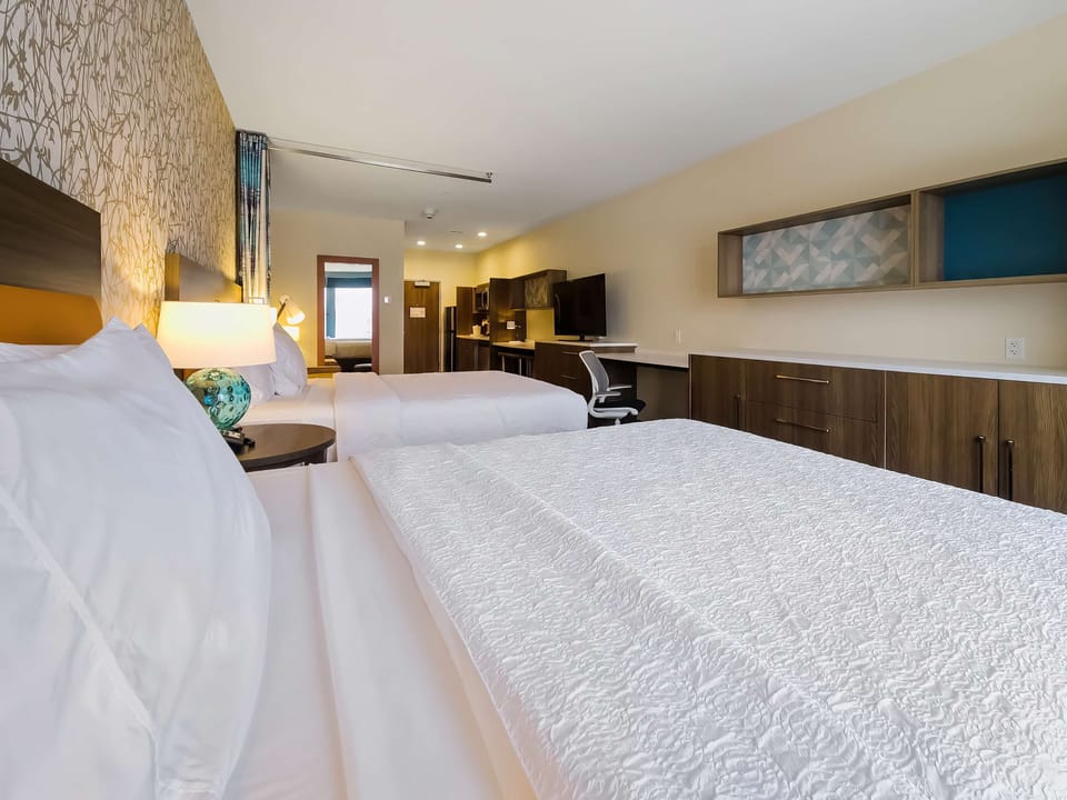 Desk, blackout drapes, iron/ironing board, free cribs/infant beds