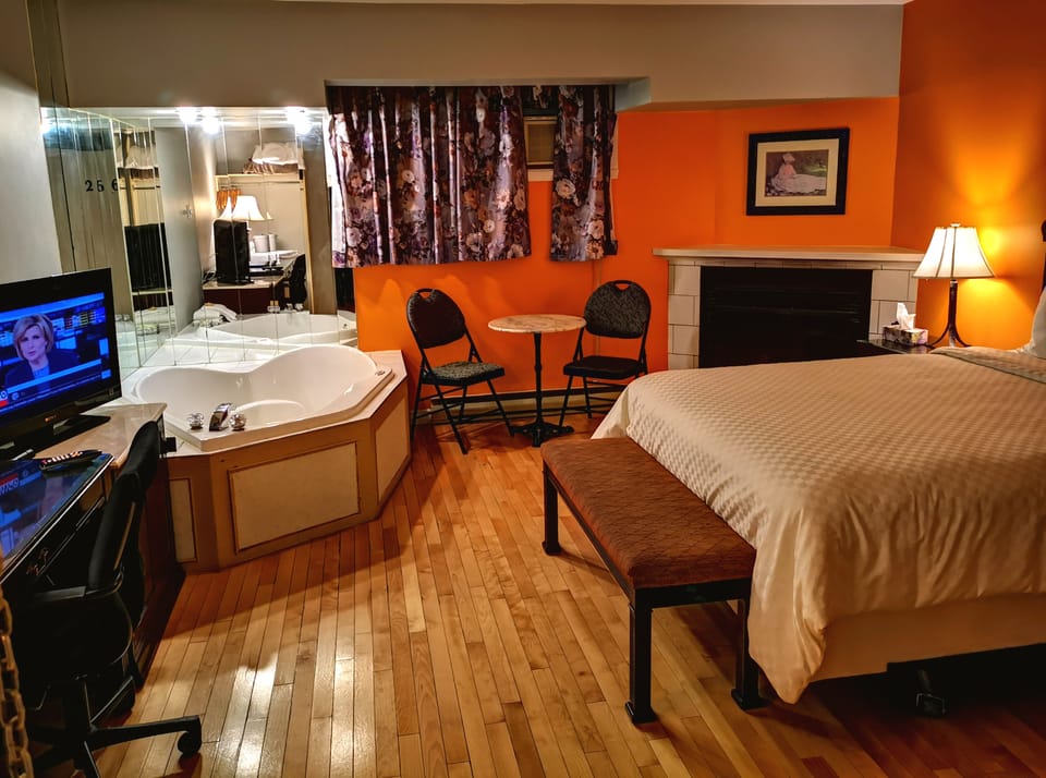 Room, 1 Queen Bed, Hot Tub ( Hardwood Floor & Fireplace) | Desk, iron/ironing board, free WiFi