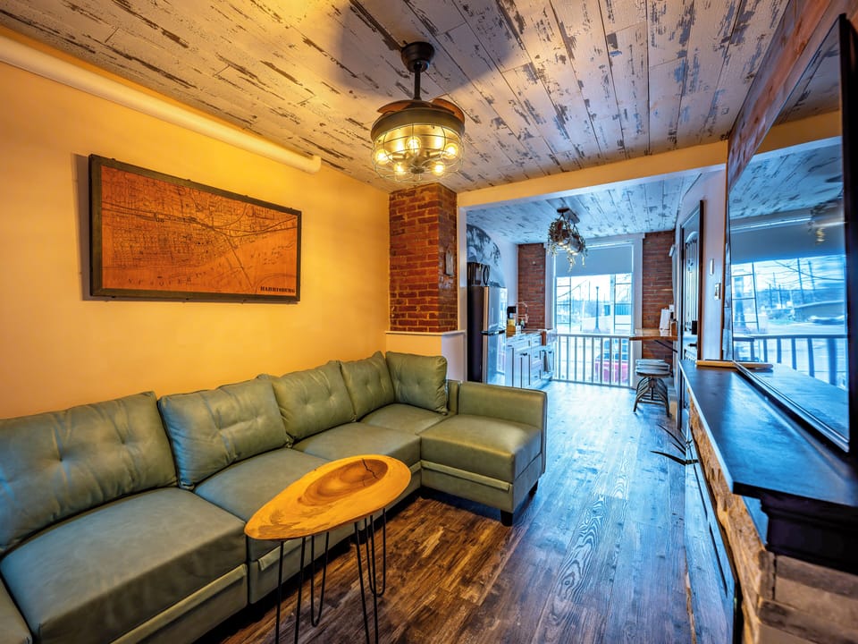 Loft, 1 Bedroom, City View | Living area | 75-inch Smart TV with digital channels, fireplace, Netflix