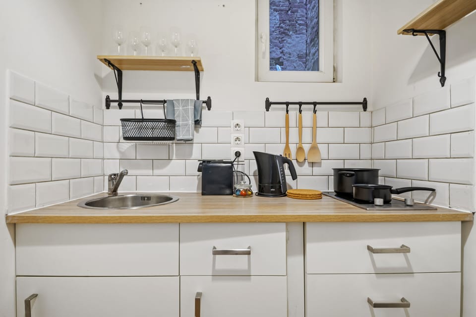 Deluxe Suite | Private kitchen | Full-size fridge, microwave, stovetop, espresso maker