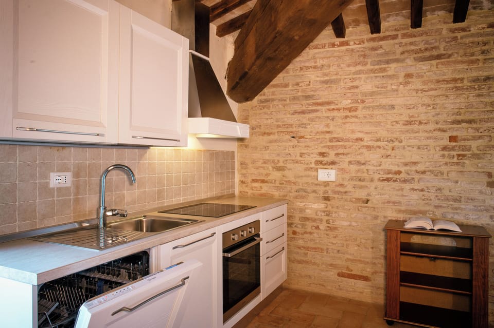 Condo | Private kitchen | Fridge, stovetop, cookware/dishes/utensils, cleaning supplies