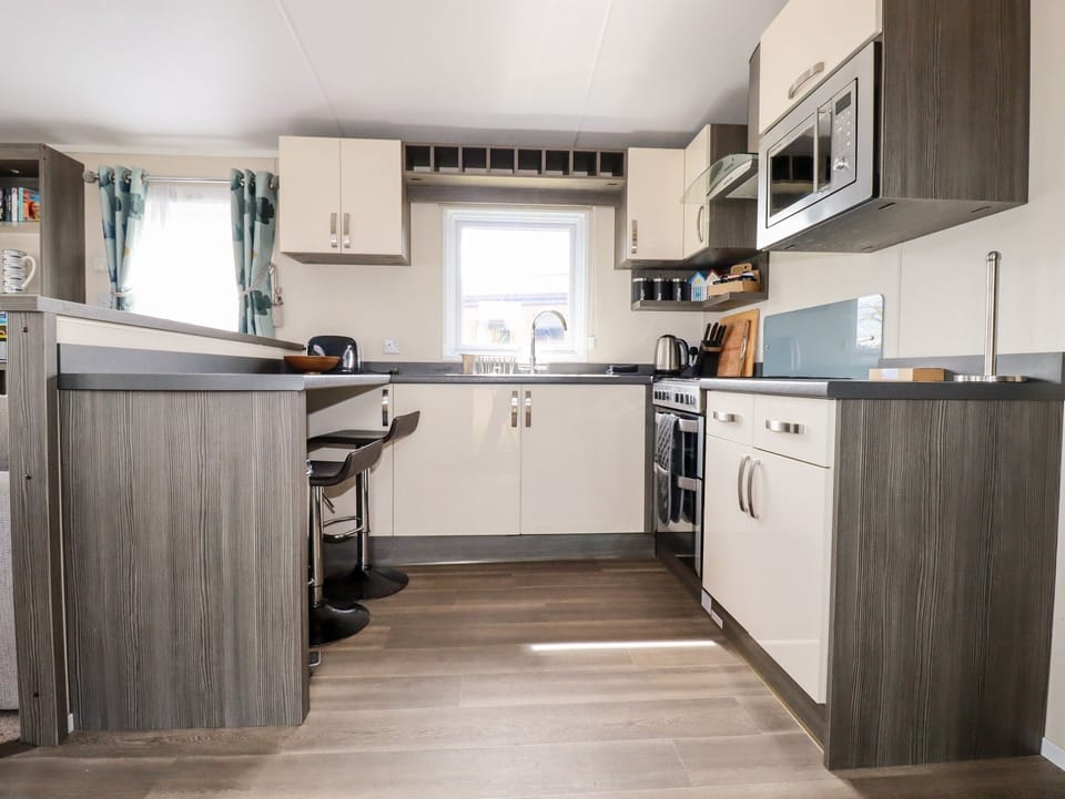 Fridge, electric kettle, toaster, cookware/dishes/utensils