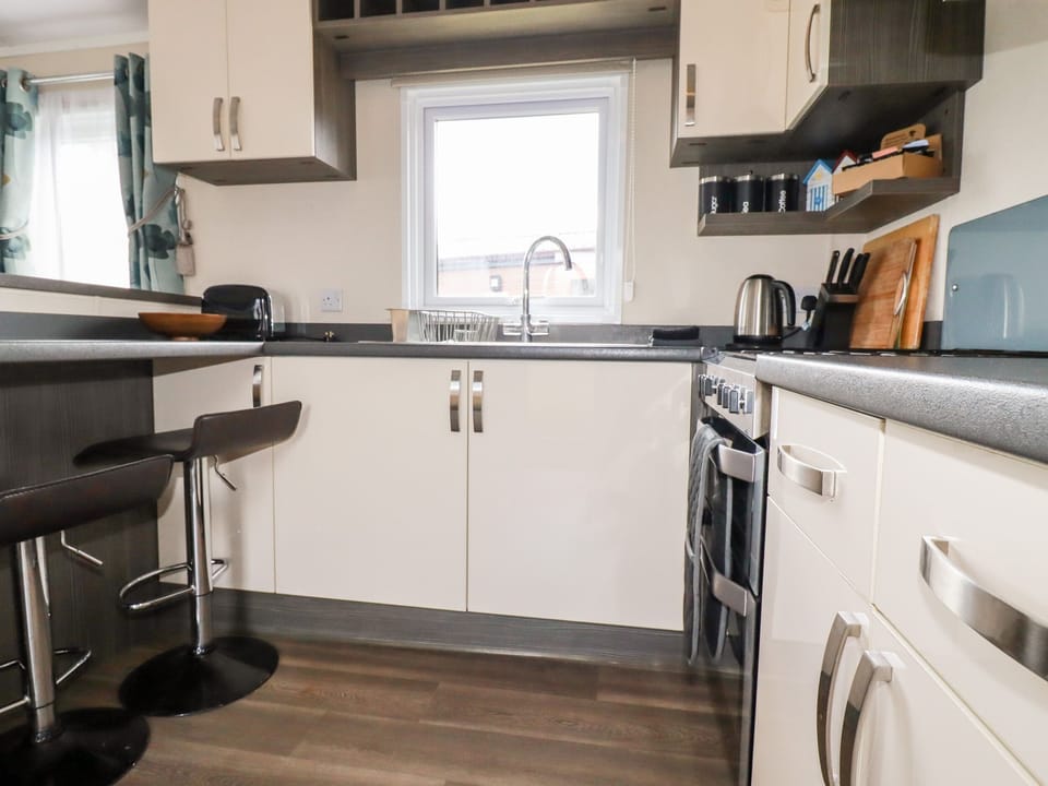 Fridge, electric kettle, toaster, cookware/dishes/utensils