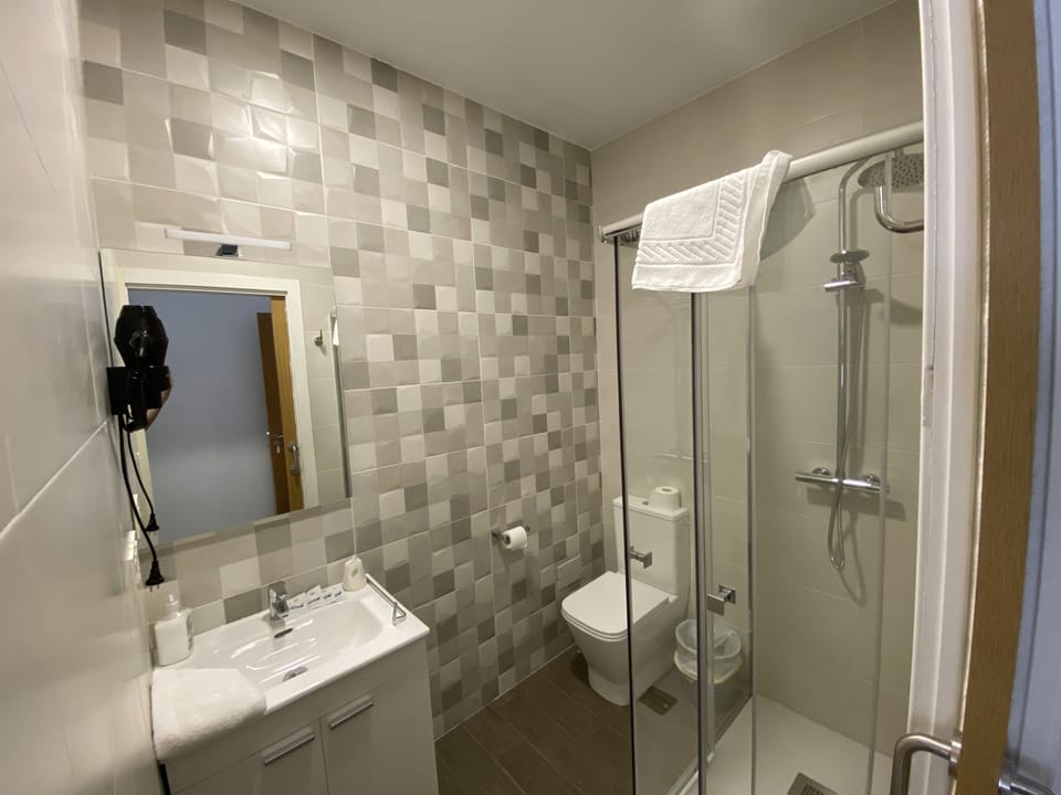 Shower, free toiletries, hair dryer, towels