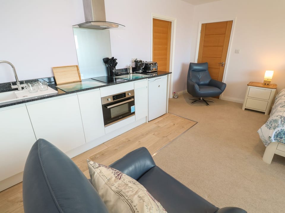 Fridge, electric kettle, cookware/dishes/utensils