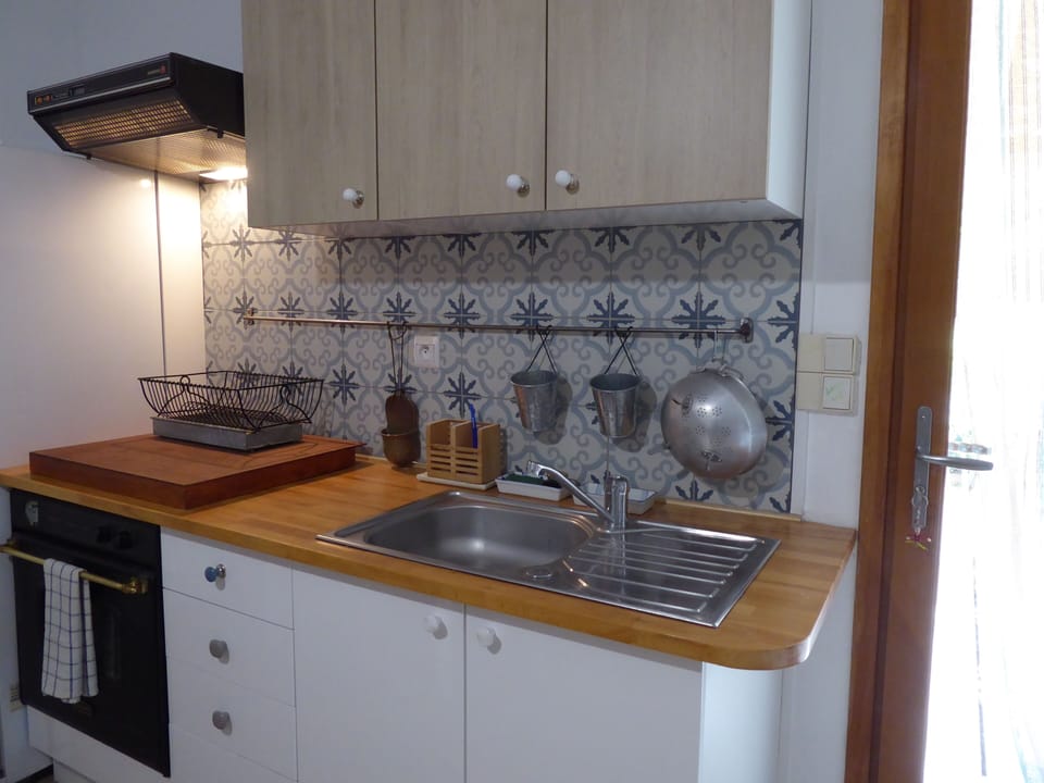 Country Cottage Drome | Private kitchen | Electric kettle, highchair, dining tables