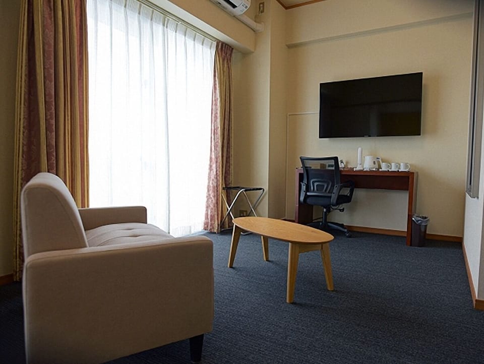 Basic Triple Room, 3 Bedrooms | Living area | 50-inch flat-screen TV with digital channels, TV
