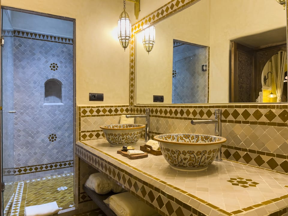 Luxury Suite | Bathroom | Shower, rainfall showerhead, designer toiletries, hair dryer