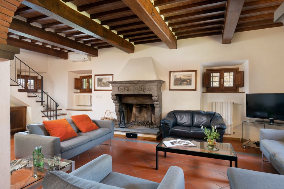 Deluxe Villa | Living area | 32-inch flat-screen TV with cable channels, TV, fireplace