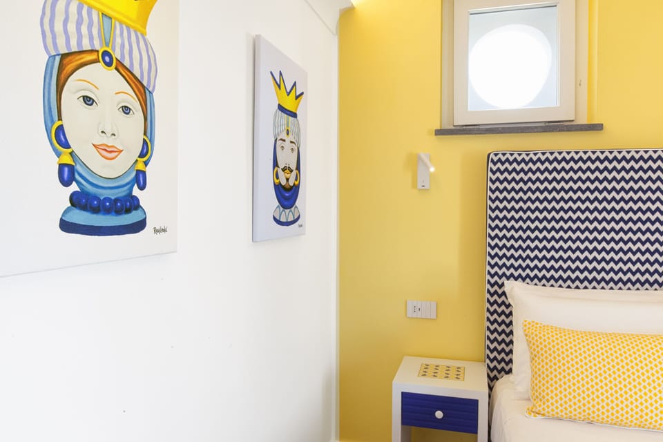 Deluxe Room, Balcony, Sea View | Minibar, in-room safe, desk, free WiFi