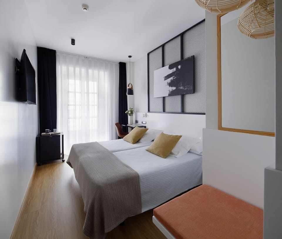 Double Room | Minibar, in-room safe, desk, blackout drapes