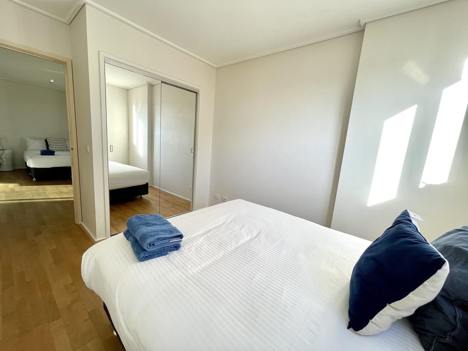 2 bedrooms, desk, laptop workspace, iron/ironing board